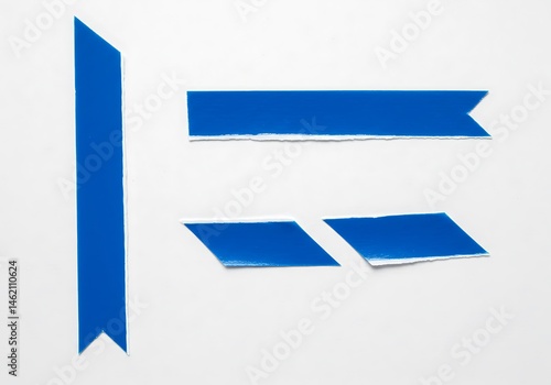 A top view of four blue paper pieces with angled ends on a white surface in a studio setting Free Download A top view of four blue paper pieces with angled ends on a white surface in a studio setting - GFXLoad