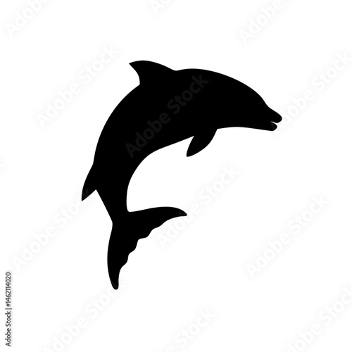 Dolphin jumps gracefully out of the water, showcasing agility and playfulness during a sunny day in the ocean