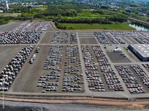 Obraz na płótnie New cars stock in a logistics parking lot in Poland w salonie
