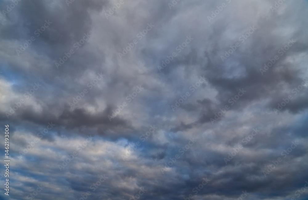 The sky covered with cumulus clouds resembles a The sky covered with cumulus clouds resembles a