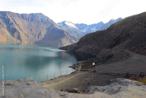 Fototapeta Naklejka Na Ścianę i Meble -  Cajon del Maipo - Embalse el Yeso area. San jose de Maipo, close to Santigao area. Lake view with mountains in the background. The lake is beautiful with unreal, scenic nature views on a sunny day.
