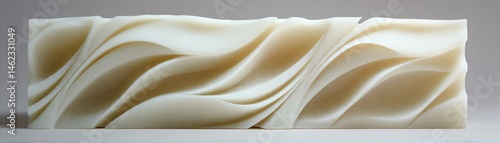 Obraz na płótnie Elegant cream-colored wave design on a white isolated background. w salonie