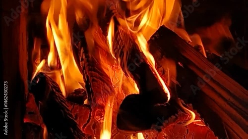 video of a fire in the fireplace in the evening