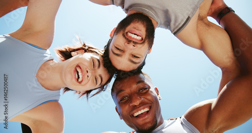 Happy people, portrait and fitness below with huddle or blue sky for workout, exercise or training together. Low angle, active group or friends with smile in circle for unity, teamwork or motivation