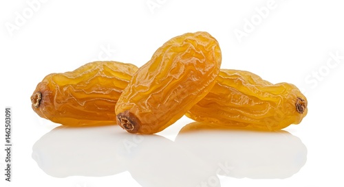 Isolated image of 3 golden raisins