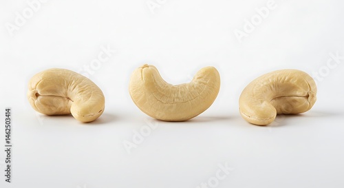 Studio-lit shot of 3 cashew nuts