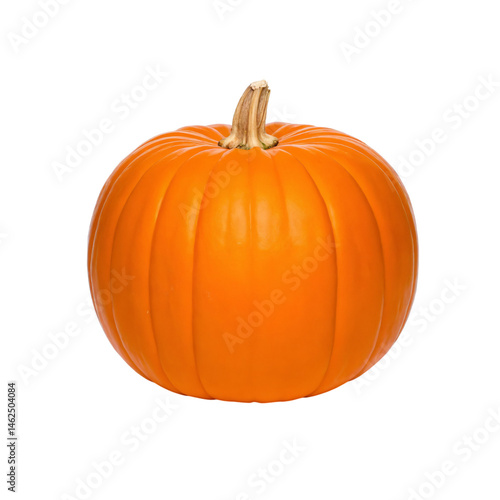 Obraz na płótnie Bright orange pumpkin resting on a clean surface, ready for autumn decorations w salonie