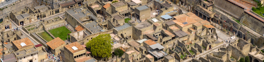 Fototapeta premium Aerial view of the remains and excavations of Herculaneum. It is an archaeological area of ​​an ancient Roman city, near Pompeii, in the province of Naples, Italy. It is a tourist destination.