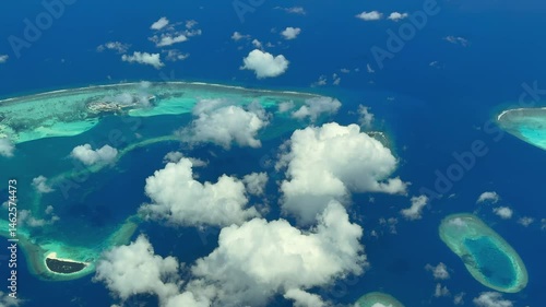 4k Aerial video footage, flying along the Island of Finolhu, Thulhaadhoo and Maagandu . The Atoll with lagoon and islands is located on the  Baa Atoll, Maldives in Indian Ocean 
