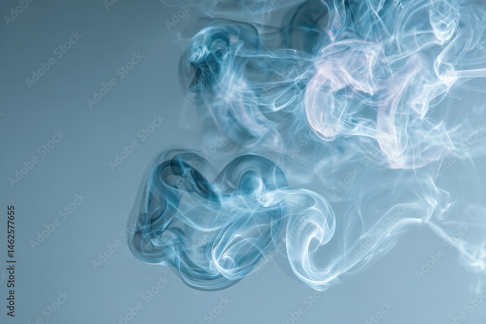 Obraz premium Abstract swirling smoke patterns in cool tones.