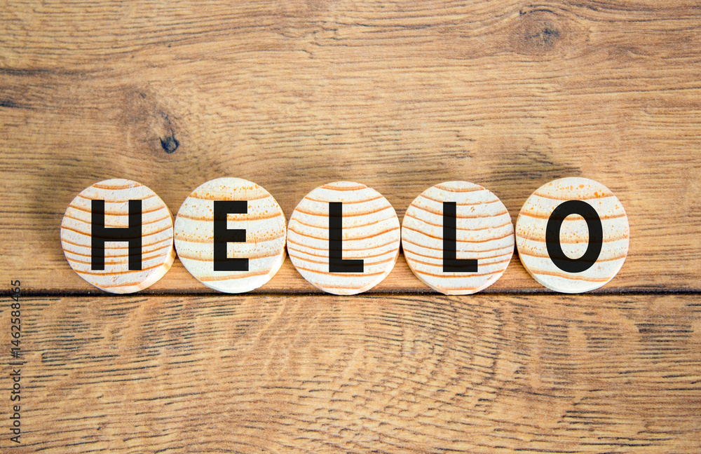Fototapeta premium Hello symbol. Concept word Hello on beautiful wooden circles. Beautiful wooden table wooden background. Business lifestyle hello concept. Copy space.