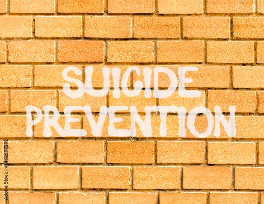 Suicide prevention symbol. Concept words Suicide prevention on beautiful brick wall. Beautiful brick wall background. Psychological and suicide prevention concept. Copy space. Suicide prevention symbol. Concept words Suicide prevention on beautiful brick wall. Beautiful brick wall background. Psychological and suicide prevention concept. Copy space.