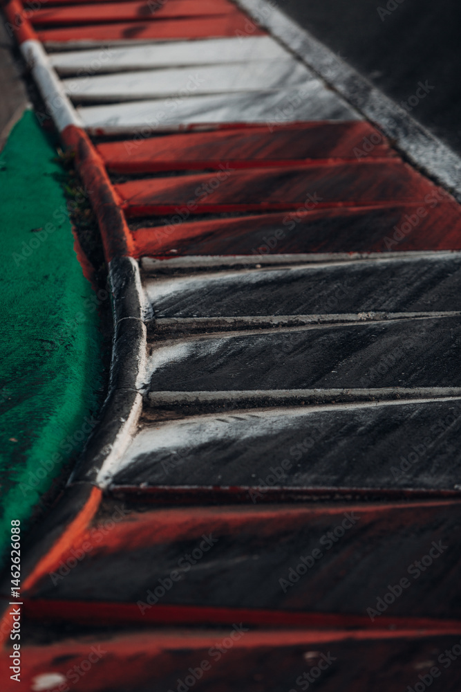 Race Track Curb with Tire Marks – Red, White and Green Kerbs Close-Up Race Track Curb with Tire Marks – Red, White and Green Kerbs Close-Up