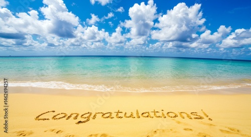 Congratulations Message Written in Sand on Tropical Beach with Blue Sky