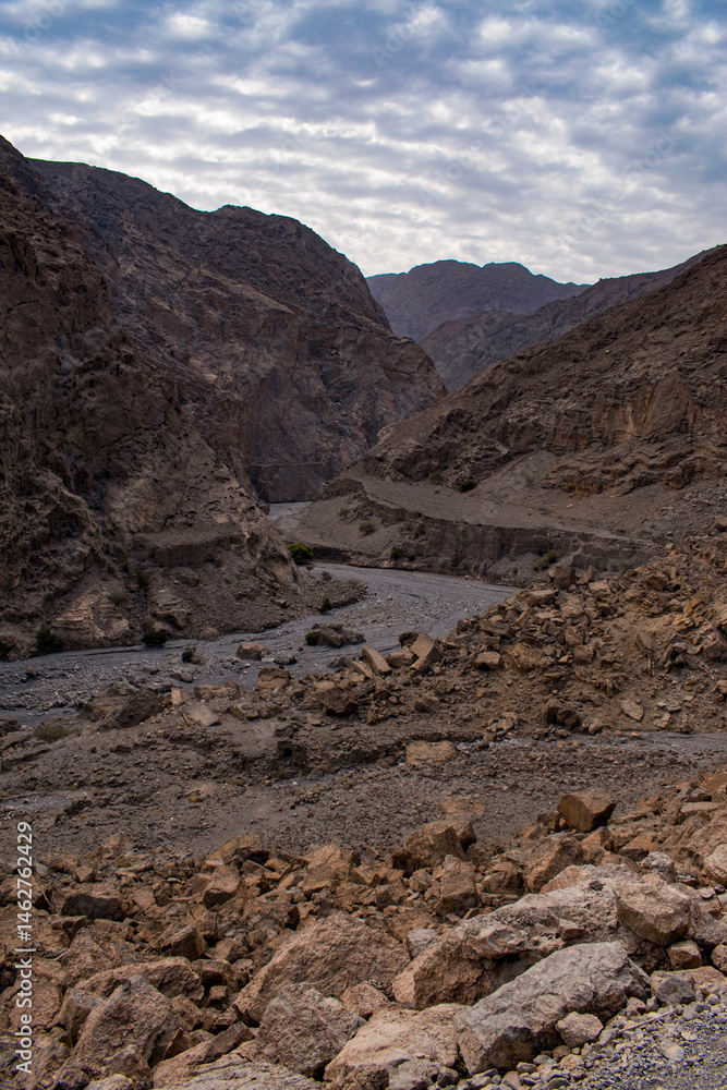 Oman, 03-06-2025: canyon and view of the winding road to Jebel Al Harim (Jabal Al Harim), the highest mountain (2,087 metres), located in the Hajar Mountains range, of the Musandam Peninsula