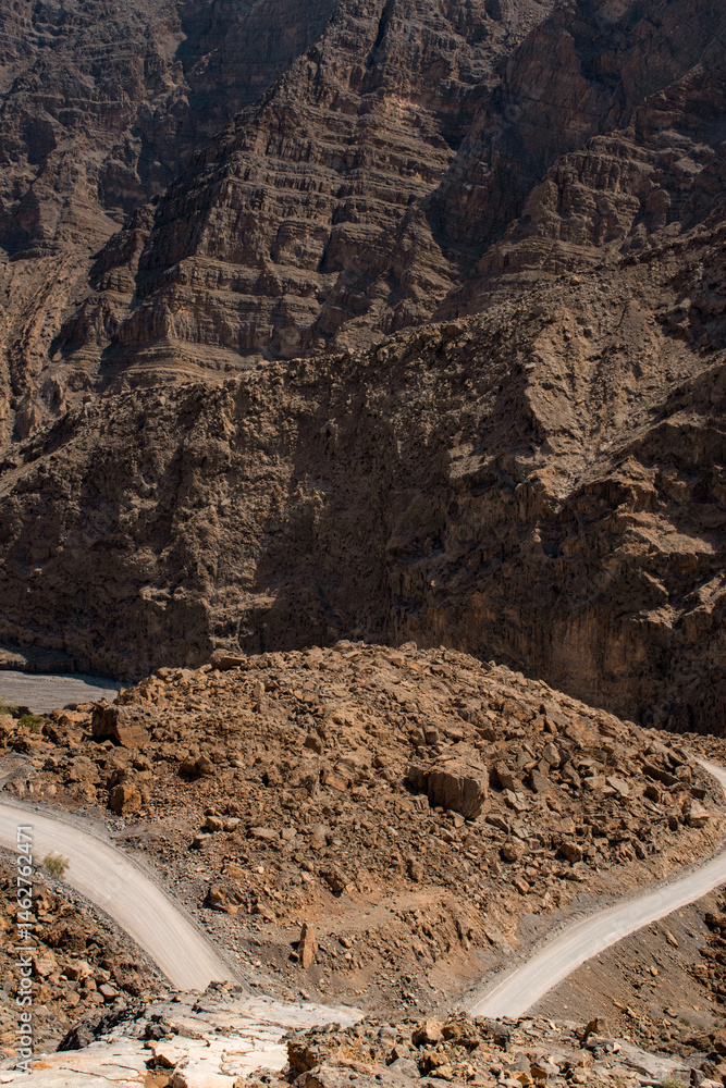 Oman, 03-06-2025: canyon and view of the winding road to Jebel Al Harim (Jabal Al Harim), the highest mountain (2,087 metres), located in the Hajar Mountains range, of the Musandam Peninsula