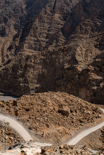 Obraz na płótnie Oman, 03-06-2025: canyon and view of the winding road to Jebel Al Harim (Jabal Al Harim), the highest mountain (2,087 metres), located in the Hajar Mountains range, of the Musandam Peninsula w salonie