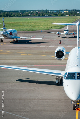 Slika na platnu Private airplanes at airfield in summer