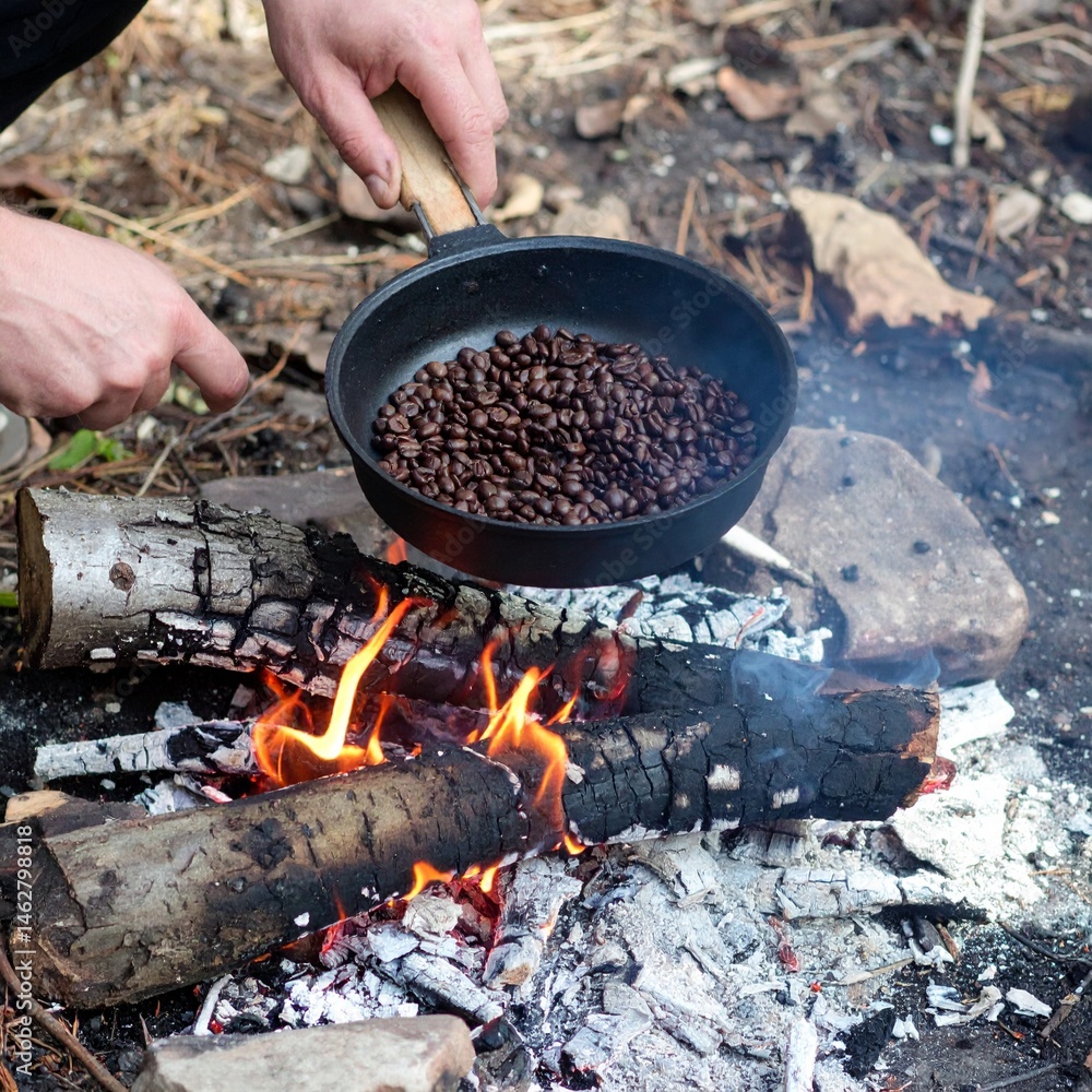 Hands Roasting Coffee Beans Over Fire in Forest Campsite Hands Roasting Coffee Beans Over Fire in Forest Campsite