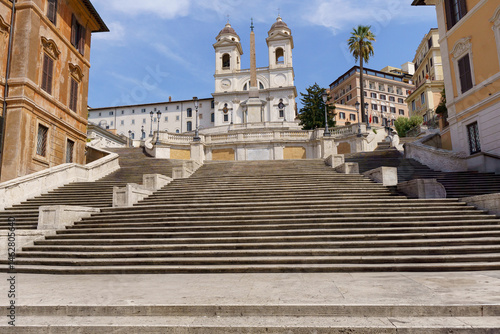 Piazza di Spagna (Spanish Steps) with Trinita dei Monti church on top and no people in Rome, Italy