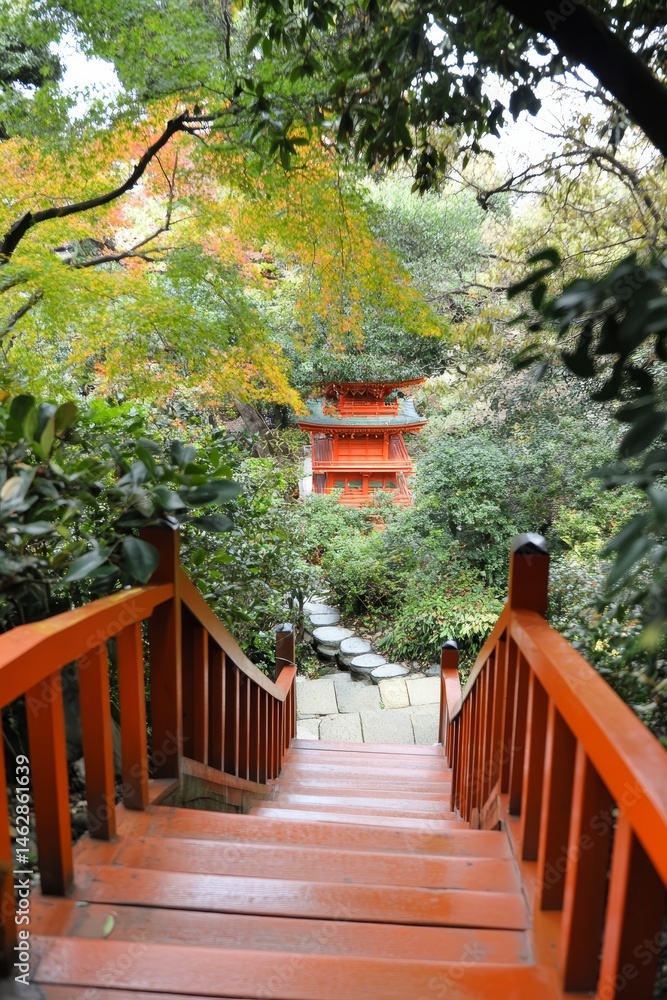 A pavilion and bridge are situated within a Japanese garden at Daigoji temple in Kyoto, Japan during the autumn season A pavilion and bridge are situated within a Japanese garden at Daigoji temple in Kyoto, Japan during the autumn season
