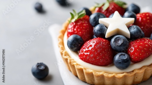 Obraz na płótnie Festive berry tart with strawberries and blueberries decorated like American flag, ideal for patriotic celebrations, Fourth of July, holiday events and food promotions w salonie