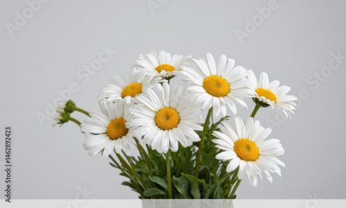 A decorative vase filled with a mix of white and yellow flowers, great for home decor or event styling