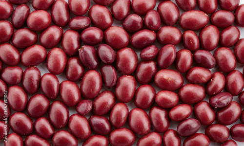 A container filled with red beans placed on a table, great for food photography or illustrations