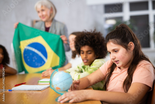 teacher is involved in lesson and conducts survey of students about nature of Brazil