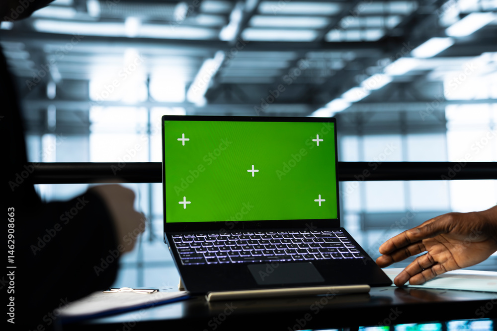 Programmers in data center using mockup laptop, inspecting server rigs, updating network topologies. Close up of IT coworkers brainstorming, using chroma key notebook, ensuring stable operations