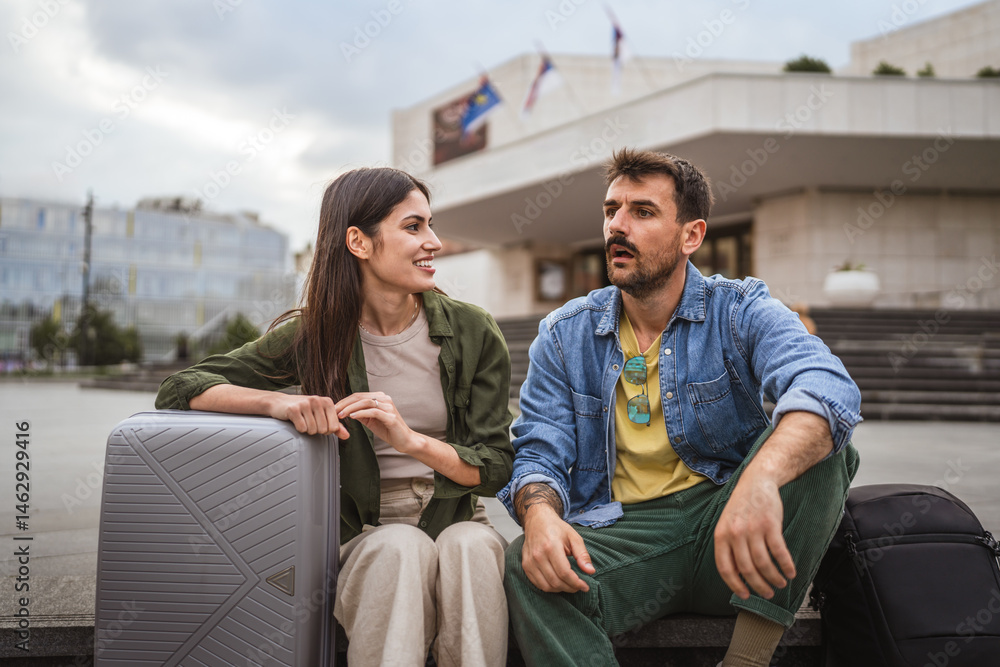 Fototapeta premium tired and exhausted tourist couple sit on the street need break