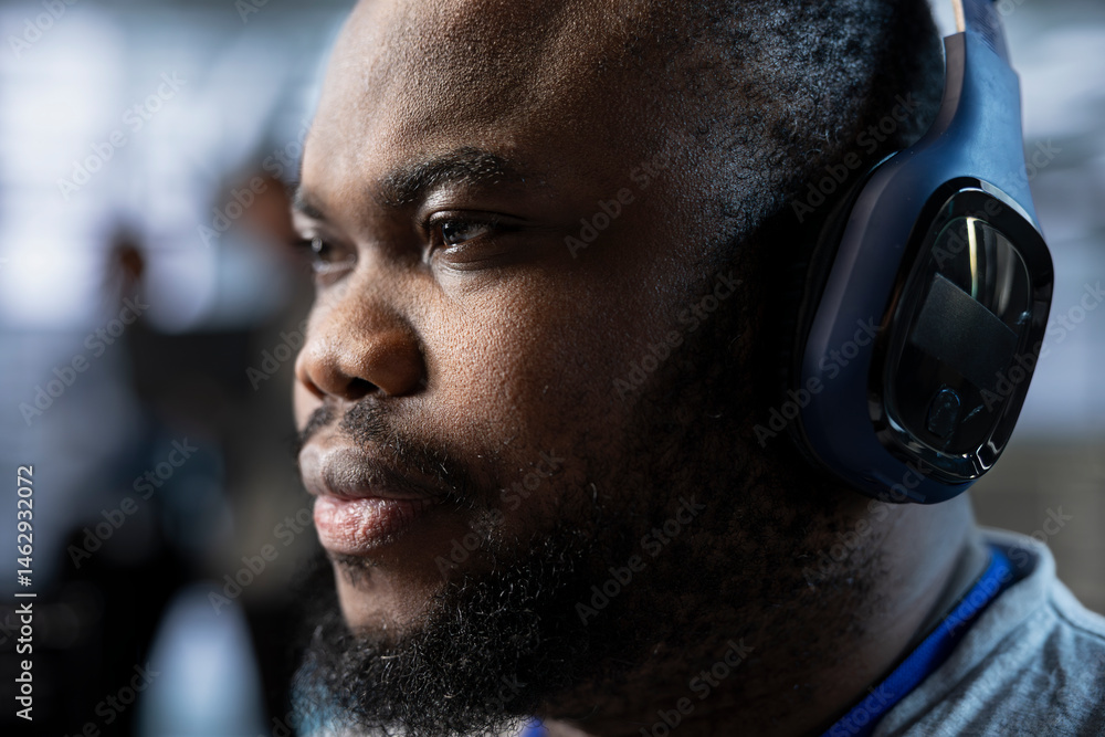 Admin in data center wearing headphones, coordinating deployment of server architecture, improving data processing speed, close up. Server farm expert hearing songs, configuring and testing equipment