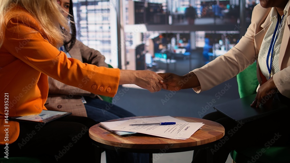Women entrepreneurs finalize a business deal by signing paperwork, highlighting leadership and career progression in a global corporation. Powerful women sign a legal contract. Close up. Camera B.