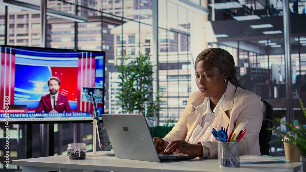Goal oriented black CEO analyzing global trends in high end office, planning the next steps for expansion and investment opportunities. Emphasizing executive power and work ethic. Camera B.