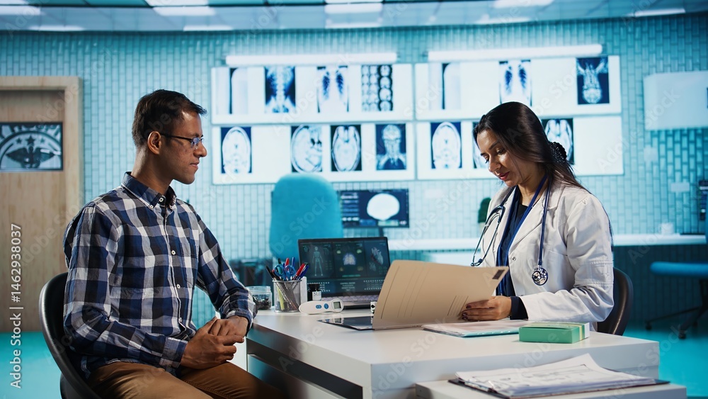 Physician meeting with patient to discuss medical test results in a cabinet, using advanced diagnostic tools to interpret x ray scans, demonstrating a professional healthcare approach. Camera B.
