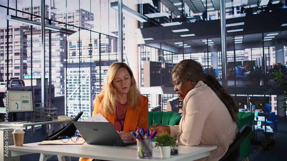 Corporate leaders demonstrating powerful collaboration and strategic thinking, share insights and big ideas in a briefing meeting. Women strategizing for growth fostering diversity. Camera B.