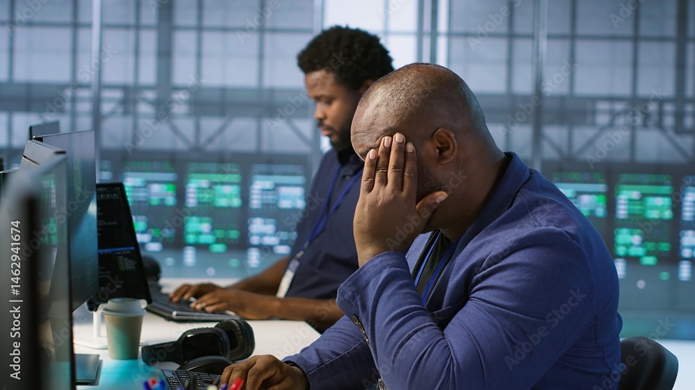Stressed engineer finally relaxing after receiving access granted notification while reconfiguring server hub. Tense admin lightens up after managing to successfully eliminate all errors