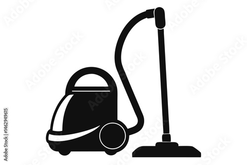 A black vacuum cleaner stands upright with its hose and wand clearly visible on white