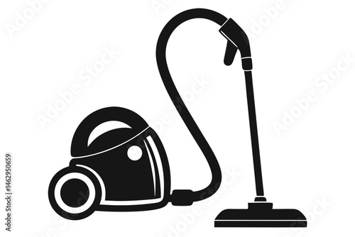 The black vacuum cleaner with flexible hose and head lies against the floor