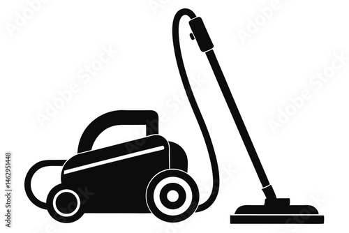 A sleek black vacuum cleaner stands ready with its hose and head on white
