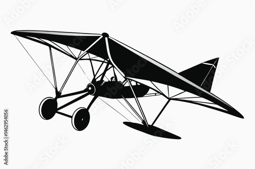 In black and white, the hang glider is flying with a pilot inside