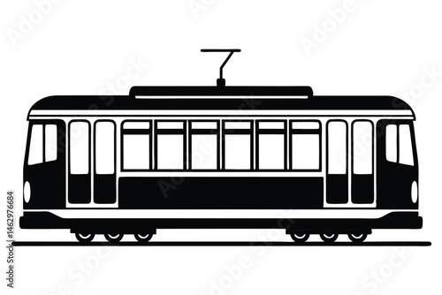 A striking black silhouette shows an old tram with overhead electrical connection