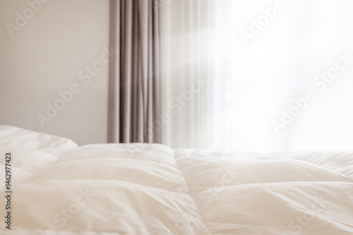 Bright Bedroom with Soft White Bedding and Curtains