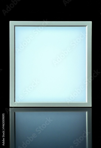 Obraz na płótnie Square white LED panel light glowing on reflective dark surface against black background w salonie