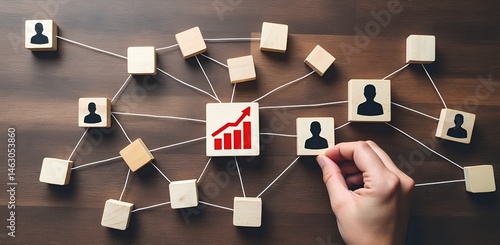 Business Network & Growth: A visual representation of interconnected blocks and networking, symbolizing the growth of a company. A hand reaches out to connect a new block.