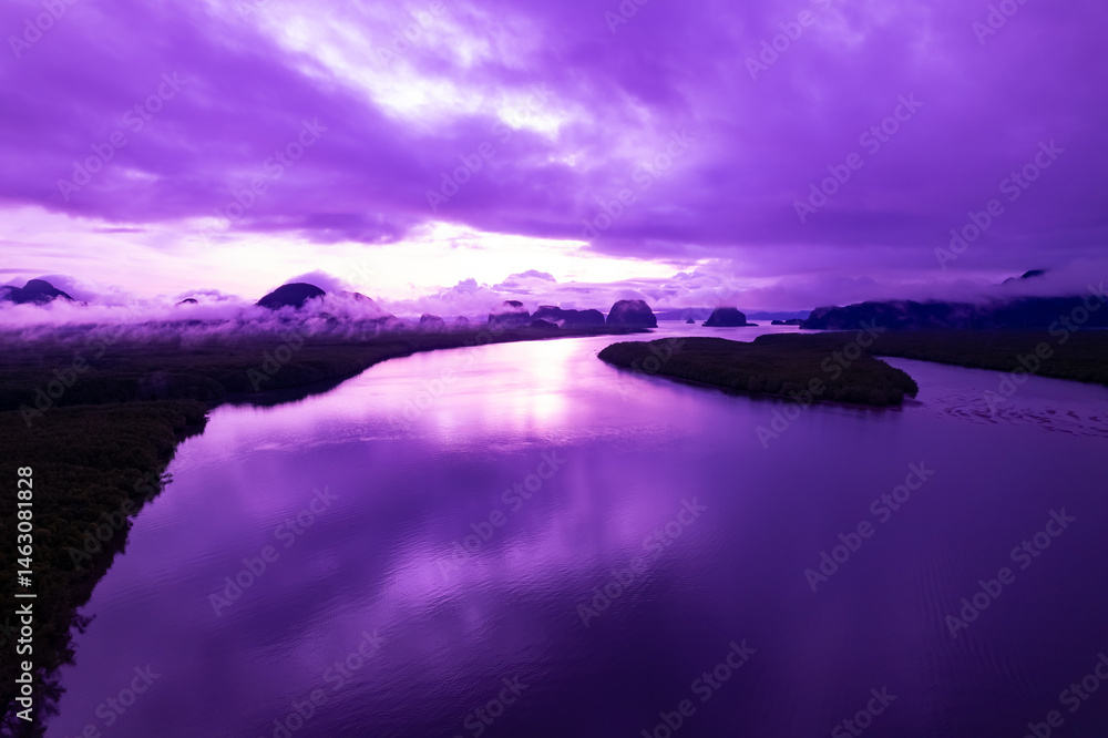 Fototapeta premium Aerial view landscape mountains colorful purple sky over sea
