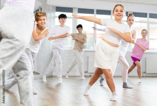 Photography Group of boys and girls rehearsing jazz funk dance in studio