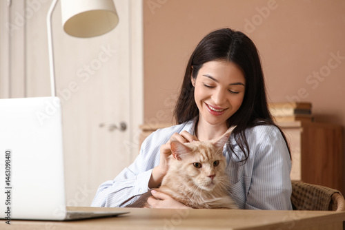 Smiling woman petting maine...
