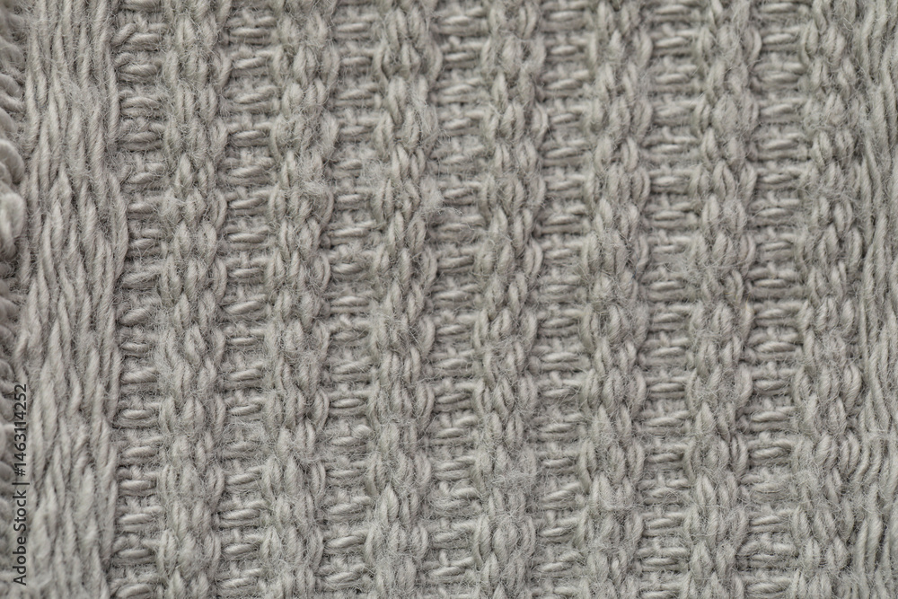 Texture of knitted woolen fabric as background, closeup Texture of knitted woolen fabric as background, closeup