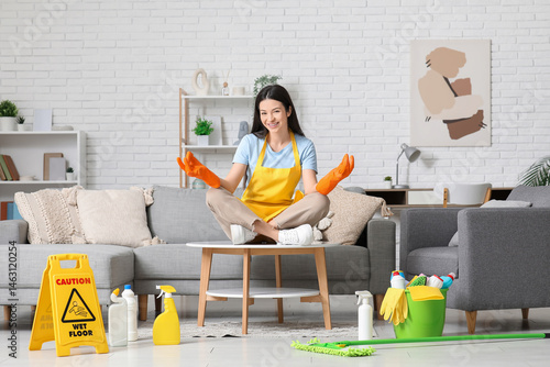 Young woman in rubber glove...